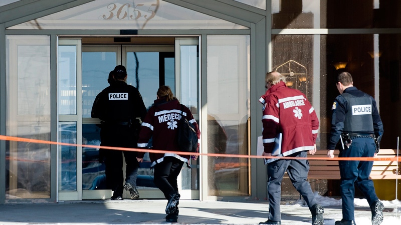 Police officers and paramedics arrive at the scene at the Chateauneuf Hotel in Laval, Que., Wednesday, Jan. 18, 2012 where former Montreal police Sgt. Ian Davidson, who allegedly tried to sell a list of police informants to the Mafia, was found dead. (Graham Hughes / THE CANADIAN PRESS)