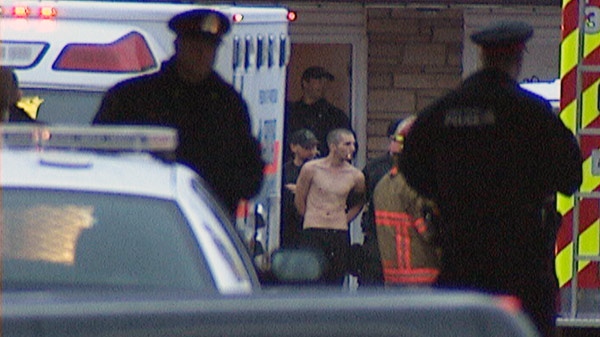 Matthew Butcher is arrested following a standoff with police at a motel in Kitchener, Ont. on Tuesday, Jan. 17, 2012.