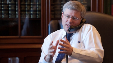 Prime Minister Stephen Harper speaks to U.S. President Barack Obama over the phone in Ottawa on Wednesday, Jan. 18, 2012.