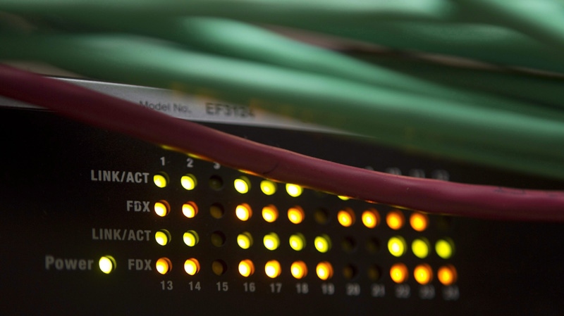 Lights on an internet switch are lit up in an office in Ottawa, on February 10, 2011. (THE CANADIAN PRESS/Adrian Wyld)