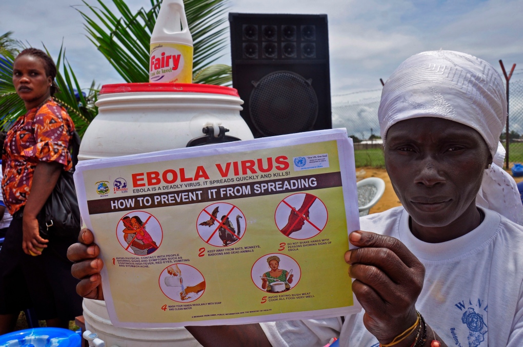 Liberian woman with Ebola pamphlet