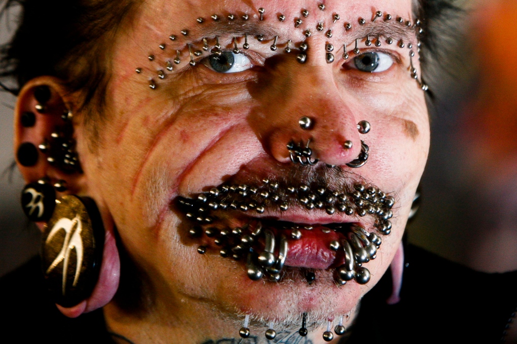 Man with most facial piercings in the world