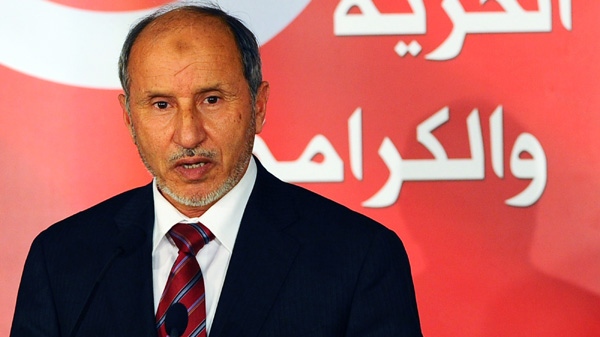 Libya's interim government, Mustafa Abdul-Jalil, delivers a speech during the opening of a photo exhibition in Tunis to mark the one-year anniversary of the revolution in Tunisia, Saturday, Jan,14, 2012.