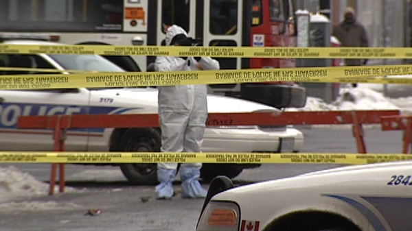 Investigators maul over the scene of a fatal stabbing in downtown Ottawa Sunday, January 22, 2012. 