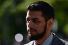 Khurram Syed Sher walks outside court in Ottawa on Tuesday, Aug. 19, 2014. (Sean Kilpatrick / THE CANADIAN PRESS)