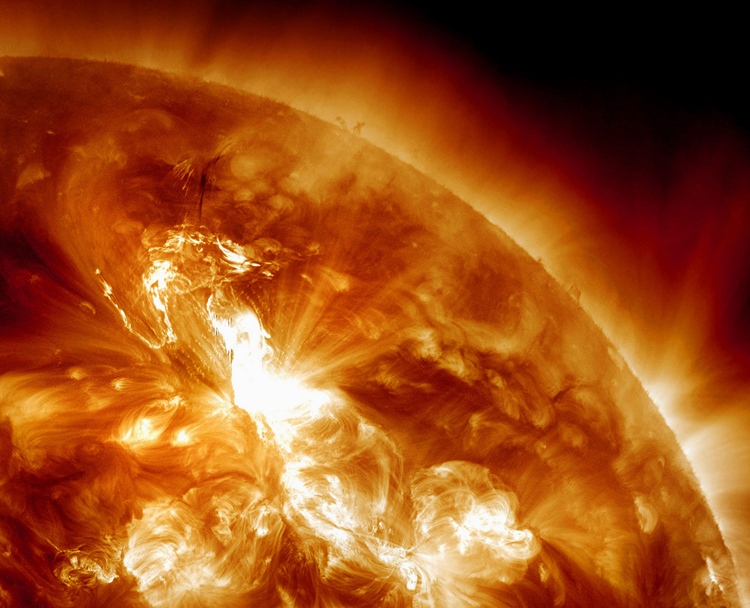 This handout image provided by NASA, taken Sunday night, Jan. 22, 2012, shows a solar flare erupting on the Sun's northeastern hemisphere.