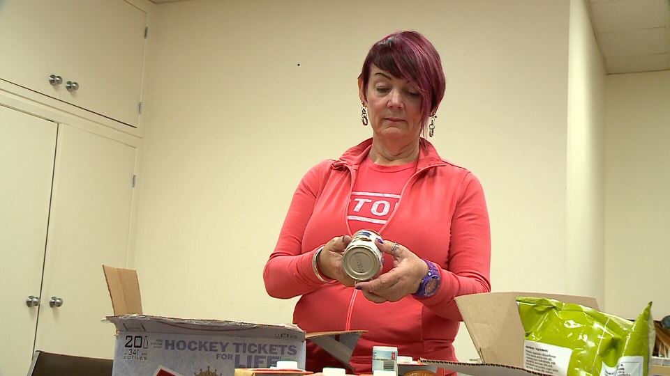 Karen Secord checks donated items at Food Centre