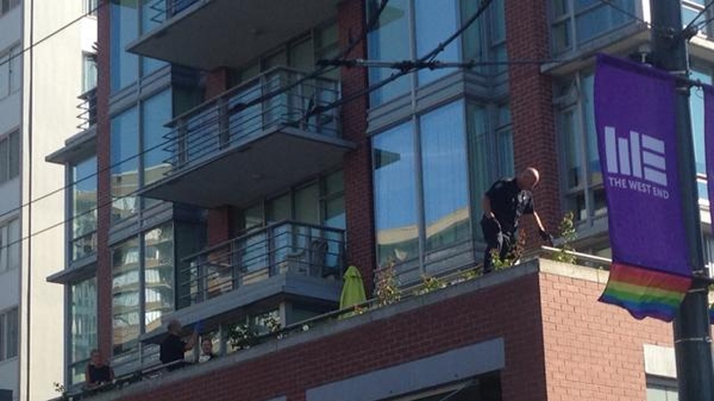 A large police presence gathered at a Davie Street apartment building after a break-in on Tuesday afternoon. Aug. 19, 2014. (CTV) 