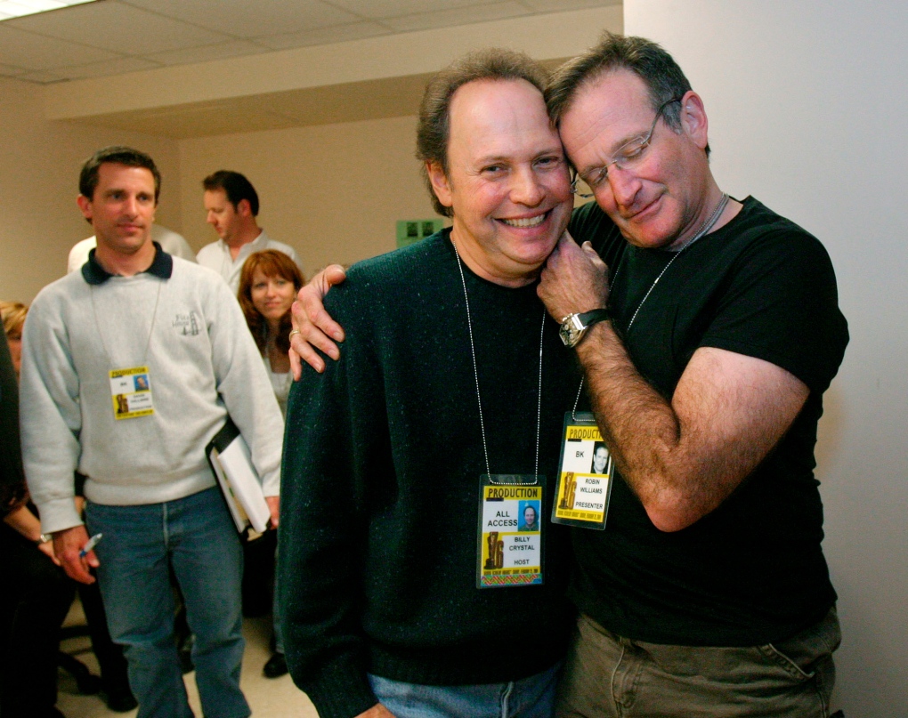 Billy Crystal jokes with Robin Williams