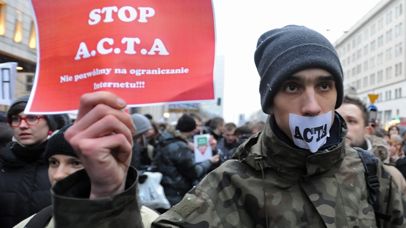 Internet activists protest against the international copyright agreement ACTA , the Anti-Counterfeiting Trade Agreement, in front of the European Parliament office in Warsaw, Poland, Tuesday, Jan. 24, 2012. (AP Photo/Alik Keplicz)