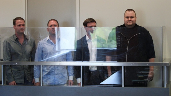 Megaupload.com employees Bram van der Kolk, also known as Bramos, left, Finn Batato,second from left, Mathias Ortmann and founder, former CEO and current chief innovation officer of Megaupload.com Kim Dotcom, right, appear in North Shore District Court in Auckland, New Zealand, Friday, Jan. 20, 2012. (Greg Bowker / New Zealand Herald)  