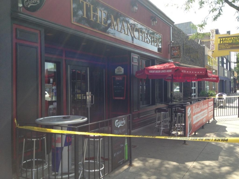 Police tape surrounds the Manchester Pub in downtown Windsor, Ont. on Monday, Aug. 25, 2014, after police say a man fell from the roof. (Rich Garton/ CTV Windsor)