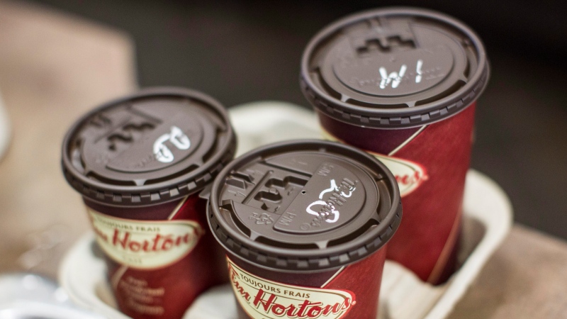 Cups of coffee sit on a counter in a Tim Hortons outlet in Oakville, Ontario on Monday September 16, 2013. (THE CANADIAN PRESS/Chris Young)