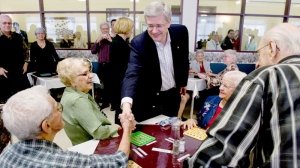 Prime Minister Stephen Harper shakes hands as he visits a seniors residence in Sanit-Hyacinthe Quebec on April 10, 2011.  (Sean Kilpatrick / THE CANADIAN PRESS)
