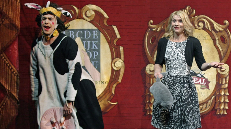 Actress Claire Danes reacts as an actor dressed as a cow performs while being honored as the Hasty Pudding Theatricals Woman of the Year at Harvard University in Cambridge, Mass., Thursday, Jan. 26, 2012.