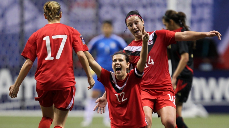 Canada's Christine Sinclair (12) celebrates her team's 3-1 win over Mexico with teammates Melissa Tancredi (14) and Brittany Timko (17) following CONCACAF women's Olympic qualifying soccer action at B.C. Place in Vancouver, B.C., Friday, Jan. 27, 2012. THE CANADIAN PRESS/Jonathan Hayward