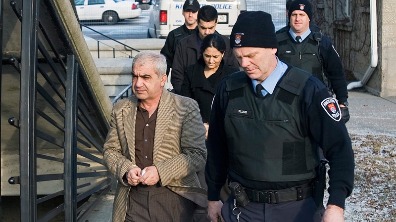 Mohammad Shafia, front, Tooba Yahya, centre and Hamed Shafia arrive at the Frontenac County courthouse in Kingston, Ont., Sunday, Jan. 29, 2011.