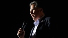 Republican presidential candidate, former Massachusetts Gov. Mitt Romney, sings as he campaigns at Lake Sumter Landing, The Villages, Fla., Monday, Jan. 30, 2012. (AP / Charles Dharapak)