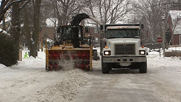 City plows clear excess snow in Ottawa on Tuesday Jan. 31, 2012.