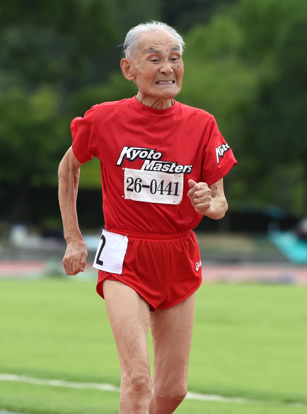 Hidekichi Miyazaki runs during the men's 100m dash