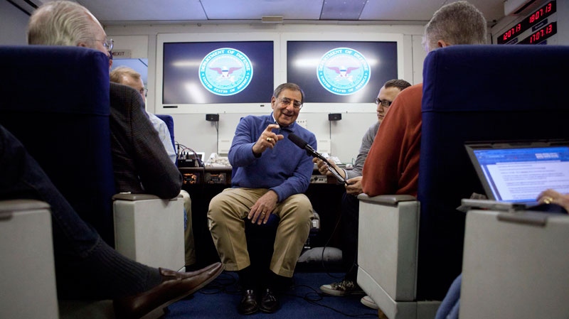Defense Secretary Leon Panetta briefs the media on board a plane en route to a NATO conference in Brussels, Belgium, Wednesday, Feb. 1, 2012. (AP / Jacquelyn Martin, Pool)