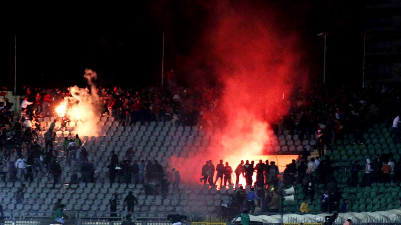 Egyptian fans rush into the field following Al-Ahly club soccer match against Al-Masry club at the soccer stadium in Port Said, Egypt Wednesday, Feb. 1, 2012. (AP Photo)