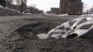 Potholes like this one can cause internal as well as external damage to your car