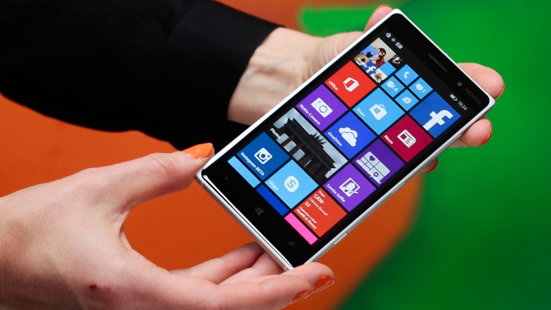 A woman shows the new Lumia 830 smart phone during a Microsoft Nokia presentation event in Berlin, Sept. 4, 2014. (AP / Markus Schreiber)