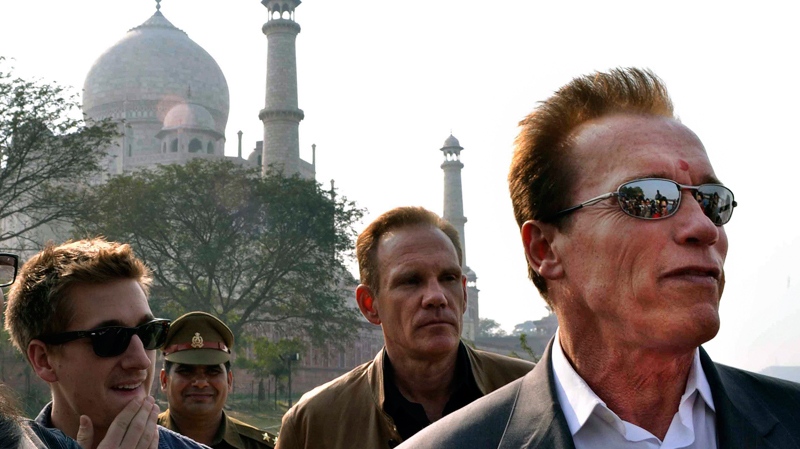 Arnold Schwarzenegger stands in front of the historic Taj Mahal, in Agra, India, Friday, Feb. 3, 2012. (AP / Pawan Sharma)