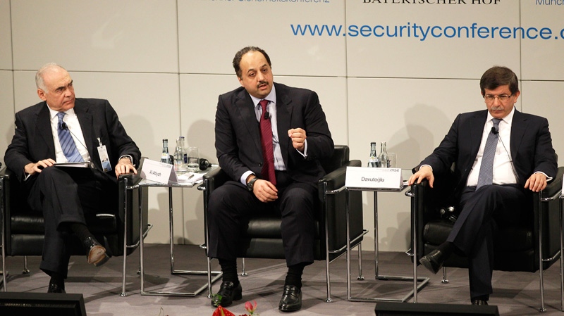 Turkey's Foreign Minister Ahmet Davutoglu, right, Quatar's Foreign Minister Khalid Mohamed A. Al-Attiyah, centre, and Egypt's Foreign Minister Mohamed K. Amr, left, talk during a panel at the Conference on Security Policy in Munich, Germany on Sunday, Feb. 5, 2012. (AP / Frank Augstein)