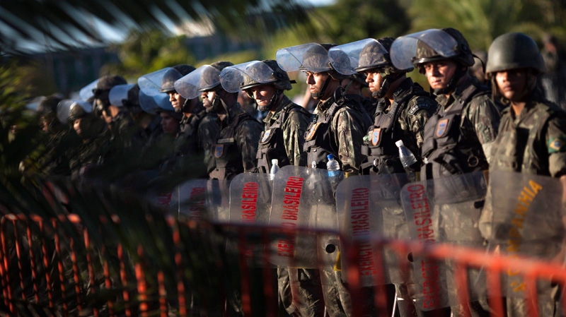 Soldiers maintain their blockade of the Bahian state legislature building, where up to 300 striking police officers and their families are holed up, in Salvador, Brazil, Tuesday, Feb. 7, 2012. (AP / Felipe Dana)