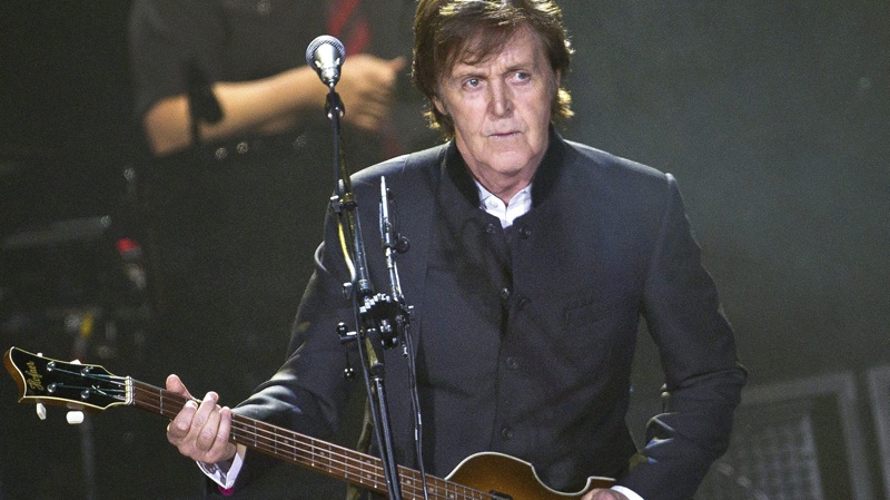 In a Monday, Dec. 5, 2011 file photo, Sir Paul McCartney performs on stage during his �Good Evening Europe� European Tour at the O2 arena in London. (AP Photo/Joel Ryan, File)