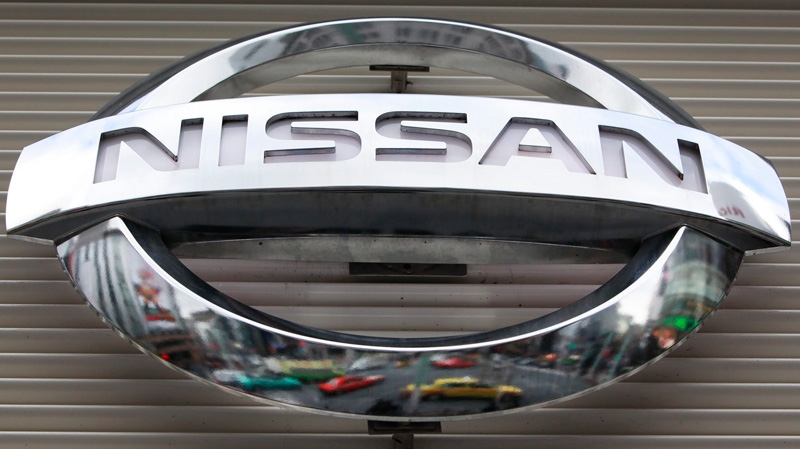 Vehicles are reflected on the logo mark of the Nissan Motors Co. at the company's showroom in Tokyo's Ginza shopping district, Wednesday, Feb. 8, 2012. (AP / Shizuo Kambayashi)