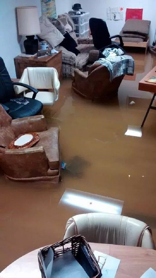 A basement filled with furniture in Essex, Ont. is flooded after a Wednesday, Sept. 11, 2014 storm brought heavy downpours. (Christine Presland Dinney/ Facebook)