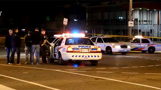 Police attend the scene of a fatal shooting in the Markham Road and Lawrence Avenue East area Sunday September 14, 2014. 