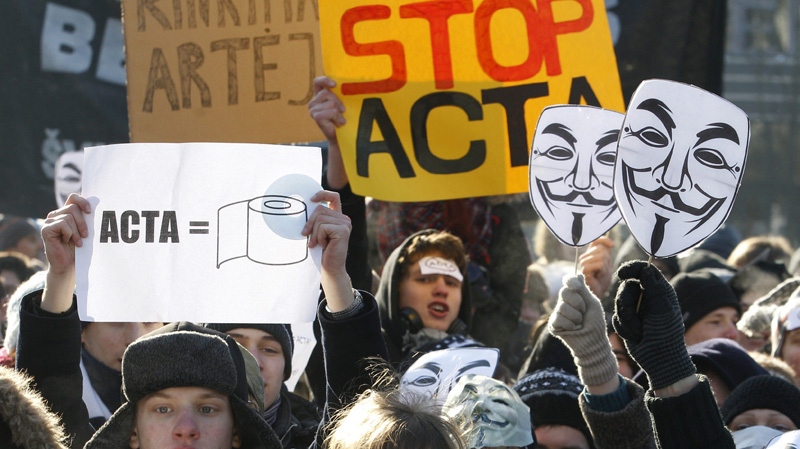 Activists protest against the Anti-Counterfeiting Trade Agreement, or ACTA, in front of the Government palace in Vilnius , Lithuania, Saturday, Feb. 11, 2012. (AP Photo/Mindaugas Kulbis)