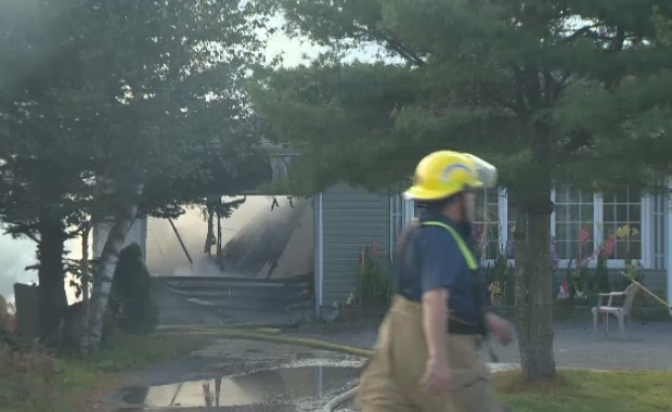 Fire fighters battle a fire on Old Sambro Road