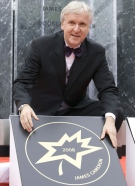 James Cameron poses with his star after unveiling it in a ceremony for Canada's Walk of Fame in Toronto on Saturday, Sept. 6, 2008. (Frank Gunn / THE CANADIAN PRESS)