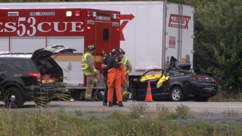 Emergency crews at the scene of a fatal collision between a car and tractor trailer in the eastbound lanes of the Queensway east of Boundary road at 7:45 a.m. on Wednesday, Sept. 17, 2014.