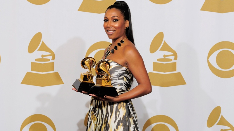 Melanie Fiona poses backstage with the awards for best traditional R and B performance for 'Fool for You' and best R and B song for 'Fool for You' at the 54th annual Grammy Awards on Sunday, Feb. 12, 2012 in Los Angeles. (AP / Mark J. Terrill)