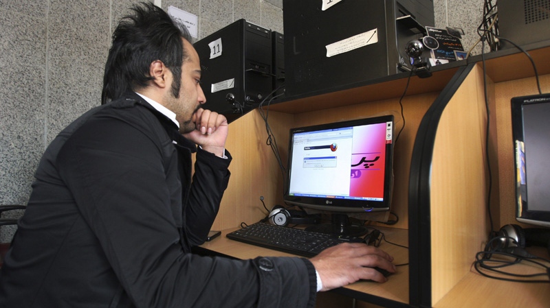 An Iranian man uses a computer in an internet cafe in central Tehran, Iran, Tuesday, Jan. 18, 2011. (AP Photo/Vahid Salemi)