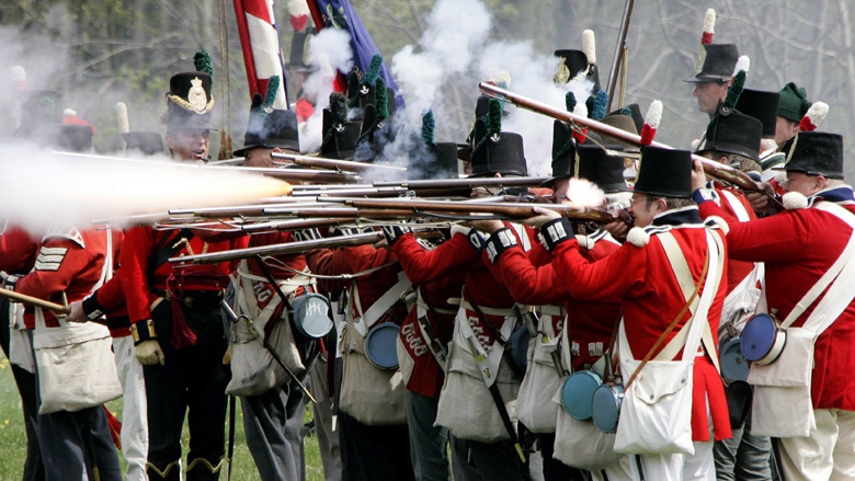In this May 5, 2007 file photo, British soldiers fire their muskets at the American forces during a re-staging of a War of 1812 battle near its actual site west of London, Ontario.  THE CANADIAN PRESS/Dave Chidley