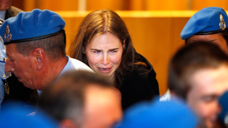 Amanda Knox  in tears after hearing the verdict that overturns her conviction and acquits her of murdering her British roommate Meredith Kercher, at the Perugia court, central Italy on Oct. 3, 2011. (AP / Pier Paolo Cito)
