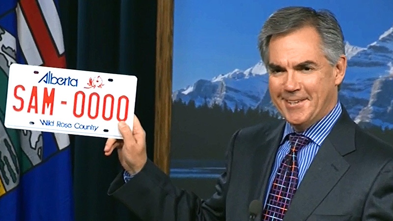 In  press conference at the Alberta legislature on Thursday, September 18, Premier Jim Prentice shows the current licence plate - saying 'This is Alberta's new licence plate'.