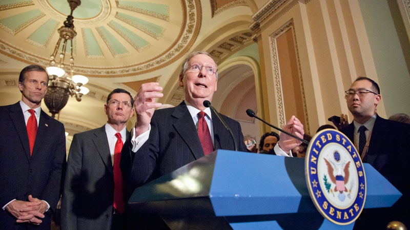 Senate Minority Leader Mitch McConnell of Ky., accompanied by, from left, Sen. John Thune, R-S.D., and Sen. John Barrasso, R-Wyo., meets reporters on Capitol Hill in Washington, Tuesday, Feb. 14, 2012, to criticize President Obama's fiscal 2013 federal budget plan. (AP / J. Scott Applewhite)