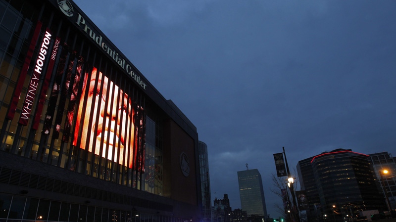 A tribute to Whitney Houston is displayed on the large video board outside the Prudential Center in Newark, N.J., Tuesday, Feb. 14, 2012. (AP Photo/Rich Schultz)