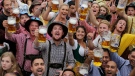 People celebrate the opening of the 181th Oktoberfest beer festival in Munich, southern Germany, Saturday, Sept. 20, 2014. (AP / Matthias Schrader)