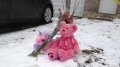 A makeshift memorial is seen at a Mooregate Crescent townhouse in Kitchener, Ont. on Wednesday, Feb. 15, 2012.