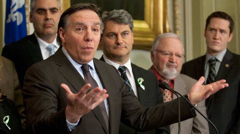 Coalition Avenir Quebec Leader Francois Legault, centre comments on the decision from Quebec Legislature Speaker Jacques Chagnon not to recognize the CAQ as an official party Tuesday, Feb. 14, 2012 at the legislature in Quebec City. (Jacques Boissinot / THE CANADIAN PRESS)