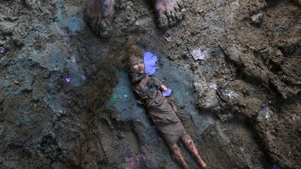 Doll smeared with mud in Srinagar, India